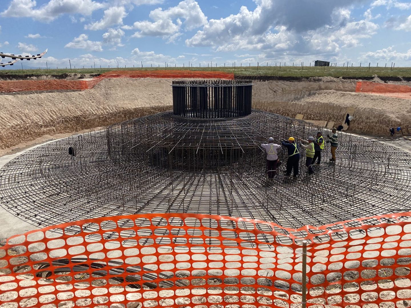 Workers assembling wind turbine foundation reinforcement cage